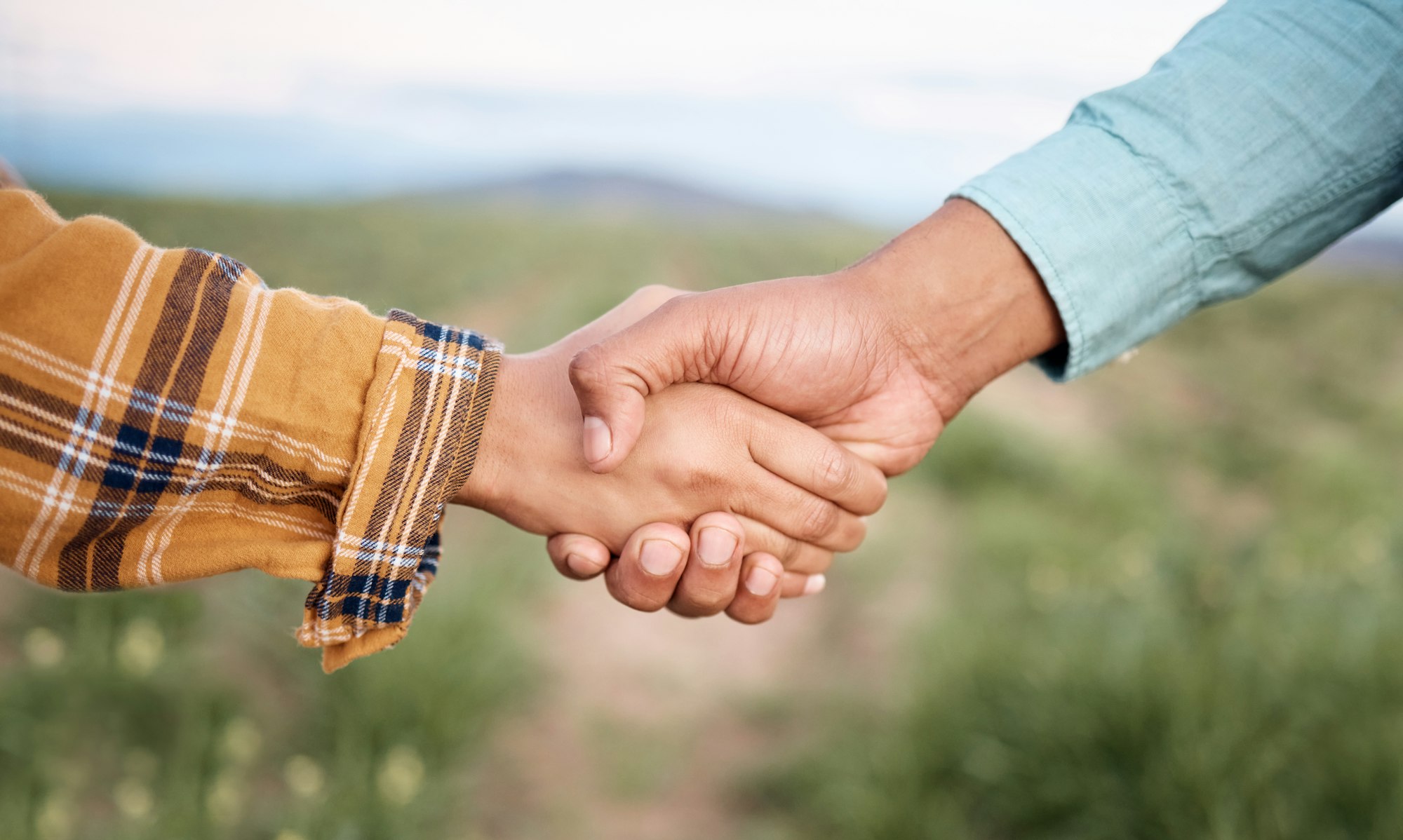 Deal, handshake and agriculture partnership at farm for sustainability teamwork, agreement or colla